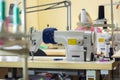 Industrial sewing machine in the workshop of the atelier Royalty Free Stock Photo