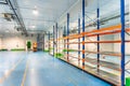 Industrial shelves for stacking and storing food products in cold storage. Royalty Free Stock Photo