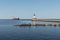 A Ship And A Lighthouse On Lake Superior Royalty Free Stock Photo