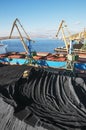 Industrial ship, Portal cranes. Loading coal into the holds of the ship in the seaport Royalty Free Stock Photo