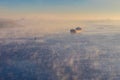 Industrial ship sailing down the river in mist at morning Royalty Free Stock Photo