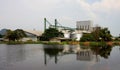 Industrial, silo near pond. Royalty Free Stock Photo