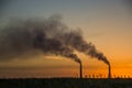 Industrial smoke from chimney at sunset, steppe near Almaty, Kazakhstan