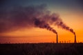 Industrial smoke from chimney at sunset, steppe near Almaty, Kazakhstan