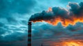 Industrial Smoke Plume at Sunset with Dramatic Clouds Royalty Free Stock Photo