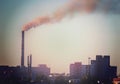 Industrial smoke stack of coal power plant in city Royalty Free Stock Photo