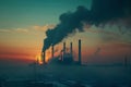 Industrial smokestacks against a sunset backdropIndustrial smokestacks against a sunset backdrop Royalty Free Stock Photo