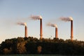 Industrial Smokestacks at Sunset Royalty Free Stock Photo