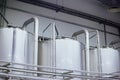 Industrial stainless steel fermentation vats in modern brewery Royalty Free Stock Photo