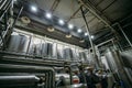 Industrial stainless steel fermentation vats in modern brewery Royalty Free Stock Photo