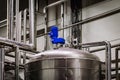 Industrial stainless steel tank in modern brewery