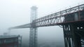Industrial Steel Bridge Construction with Tower in Heavy Fog, Engineering Structure and Metal Framework Architecture in Misty Royalty Free Stock Photo