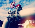 Industrial Steel pipelines and valves against blue sky Royalty Free Stock Photo