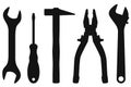 Industrial tools kit - spanner, screwdriver, hammer, pliers, adjustable wrench. Black silhouettes