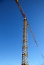 Industrial tower crane against blue sky Royalty Free Stock Photo