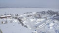 Industrial town on river bank in winter. Clip. Top view of town with marine industry near river bank. Marine industrial Royalty Free Stock Photo