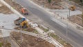 Industrial truck loader excavator moving ground and loading into a dumper truck timelapse Royalty Free Stock Photo