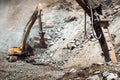 Industrial type excavator digging at a quarry or a construction site