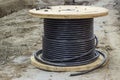 Industrial underground cable on large wooden reel Royalty Free Stock Photo