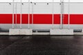 Industrial, urban background. Red and grey metal wall and empty parking lot.