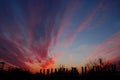 Industrial urban landscape against the background of the sky with  red sunset and clouds Royalty Free Stock Photo