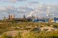 An industrial urban scenery of a steelworks with smoking pipes in IJmuiden, the Netherlands.