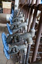 Industrial Valve Array: Close-Up on a Row of Blue-Handled Control Valves Royalty Free Stock Photo