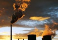 Industrial view. golden smoke from factory during sunset