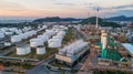 Industrial view at oil refinery plant form industry zone with sunrise and cloudy sky.Oil refinery and Petrochemical plant at dusk