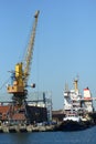 Industrial view of sea port warehouse, container cranes and ships. Import export, global logistics Royalty Free Stock Photo