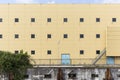 Industrial Wall With Seagull Sitting On Top of Light Poll Royalty Free Stock Photo