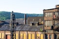 Industrial warehouse complex with broken windows, yellow panels in brick construction