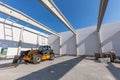 Industrial warehouse construction. Rotating telehandler vehicle