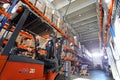 Industrial warehouse. Warehouse of a trade organization. Goods and materials arranged on a rack in warehouse. Warehouse store