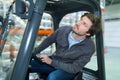 industrial warehouse worker operating forklift Royalty Free Stock Photo