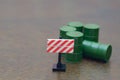 Industrial Warning Scene with Hazard Sign and Toxic Material Barrels Royalty Free Stock Photo
