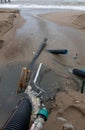 Industrial wastewater, the pipeline discharges liquid industrial waste into the sea on a city beach. Dirty sewage flows from a