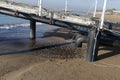 Industrial wastewater, the pipeline discharges liquid industrial waste into the sea on a city beach. Dirty sewage flows from a