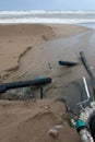 Industrial wastewater, the pipeline discharges liquid industrial waste into the sea on a city beach. Dirty sewage flows from a