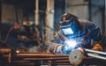 Industrial welder working welding repairing