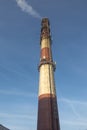 Industrial white, red, high concrete chimney Royalty Free Stock Photo