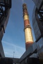 Industrial white, red, high concrete chimney Royalty Free Stock Photo