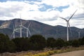 Industrial windmills create a wind farm in the landscape. Royalty Free Stock Photo