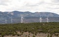 Industrial windmills create a wind farm in the landscape. Royalty Free Stock Photo