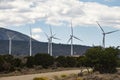 Industrial windmills create a wind farm in the landscape. Royalty Free Stock Photo