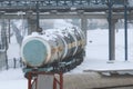 Industrial winter landscape with wagons, infrastructure and tubing