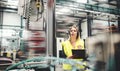 Industrial woman engineer with headset in a factory, working. Copy space. Royalty Free Stock Photo