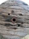 Industrial wooden spool with rusted metal rivets Royalty Free Stock Photo