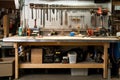 an industrial workbench with tools and supplies in the background