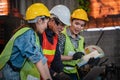 Industrial worker background of industrial chief engineer explaining job detail to factory workers in metal work manufacturing